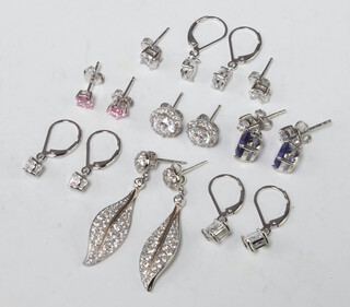 8 pairs of silver earrings