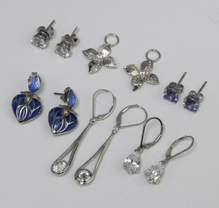 Six pairs of silver earrings 