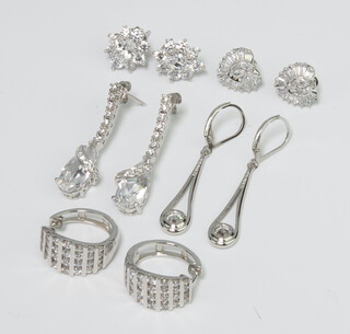 A pair of silver paste earrings and 4 other pairs