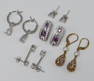 A pair of silver ear studs and 4 other pairs of silver earrings