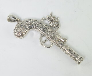 A sterling silver whistle in the form of a percussion pistol 23 grams