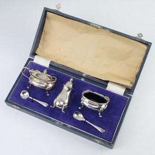 A silver 3 piece condiment raised on pad feet Birmingham 1965, 124 grams 