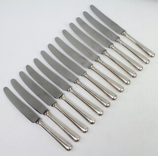 A set of 12 dinner knives with silver handles, Sheffield 1962 and 1 other 