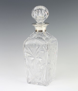 A cut glass tapered decanter with silver collar London 1969, 27cm 