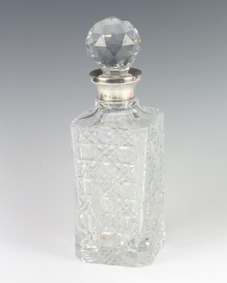 A cut glass spirit decanter with silver collar London 1969, 27cm 