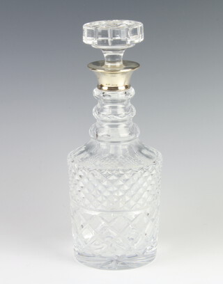 A cut glass silver mounted cylindrical decanter and stopper, London 1967, 29cm 