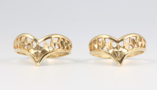 A pair of 9ct yellow gold pierced rings size N 1/2, 4 grams