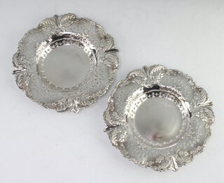 A pair of Victorian circular silver bon bon dishes with scroll decoration Sheffield 1895, 13cm, 194 grams 