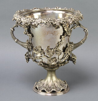 An Edwardian silver plated 2 handled champagne cooler with vinous decoration and rustic handles 28cm 