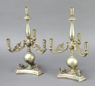 A pair of Victorian ex plated candelabra decorated swans 30cm 