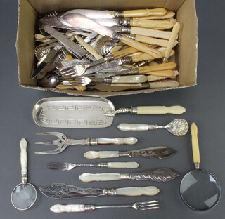 A quantity of lily pattern silver plated cutlery with mother of pearl and ivory handles 