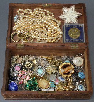 A carved vinous decorated jewellery box containing vintage and other costume jewellery