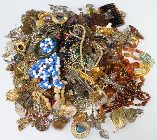 A quantity of costume jewellery including bead necklaces brooches etc 