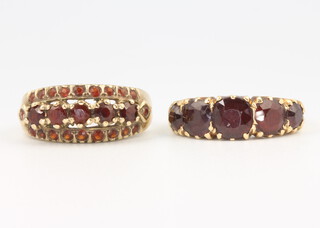 An 18ct yellow gold garnet set ring size M, 3.7 grams and a yellow gold ditto size L grams 