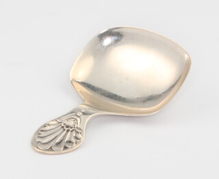 A silver caddy spoon with shell handle Sheffield 1934, 5.5cm 8.7 grams