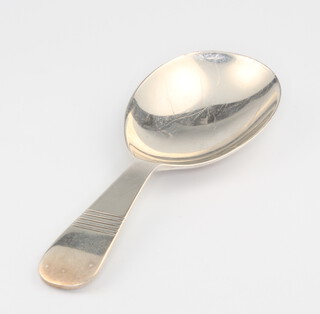 A silver caddy spoon with engraved handle Birmingham 1955, 9.5cm, 17.3 grams