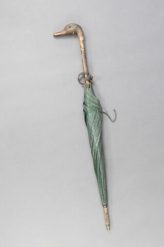 An Edwardian parasol with carved ducks head handle, having glass eyes 87cm 