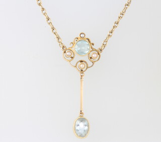 A 15ct yellow gold aquamarine and pearl pendant 34mm and 9ct chain 4 grams