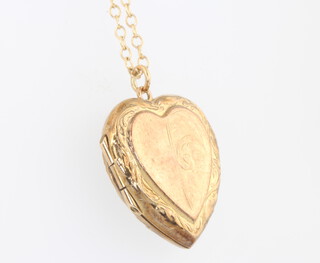 A 9ct yellow gold plated heart locket hung on a 9ct yellow gold chain 1 gram, 20cm 