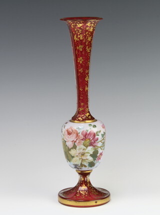 A 19th Century Bohemian red glass overlay vase decorated with spring flowers and scrolling gilt leaves 25cm 