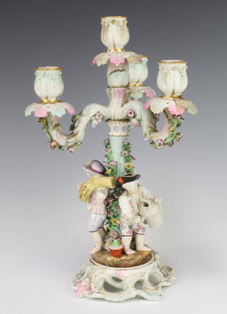 A 19th Century German 4 light candelabrum, the base with 3 figures 34cm 