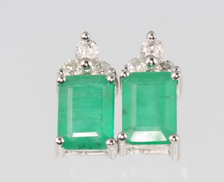 A pair of 14ct white gold rectangular emerald and diamond ear studs, the emeralds approx. 1.66ct, the brilliant cut diamonds 0.2ct, 12mm, 2.49 grams