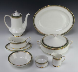 A Royal Albert and Paragon matched Kensington pattern service comprising 10 coffee cups, 10 saucers, coffee pot, cream jug, sugar bowl, 10 two handled bowls, 10 saucers, 10 dessert bowls, 10 soup bowls, sauce boat and stand, 2 meat plates, 10 small plates, 10 medium plates, 9 dinner plates, 2 tureens and covers, 3 oval serving dishes 