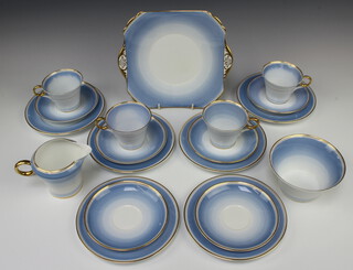 A Shelley Art Deco Regency pattern part tea set no.12877 comprising 4 cups (1 stuck), 6 saucers, 6 small plates, sandwich plate, milk jug and sugar bowl 