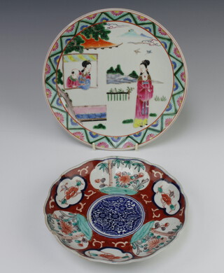An early 20th Century famille rose plate decorated with figures before a pavilion with distant mounts 25cm together with an Imari scalloped dish decorated flowers 21cm (chipped)