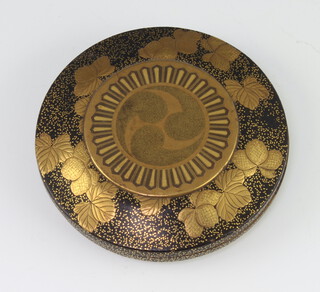 A good Japanese Meiji period circular lacquered palm box decorated with flowers on a speckled ground, the interior with 2 colour flowers, 8cm 