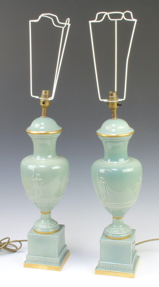 A pair of 20th Century Continental ceramic table lamps decorated classical figures on square bases 49cm 