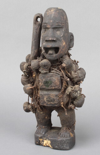 A "Voodoo" carved figure of a standing man 30cm x 9cm x 6cm 