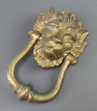 A brass lion mask door knocker 25cm x 14cm 
