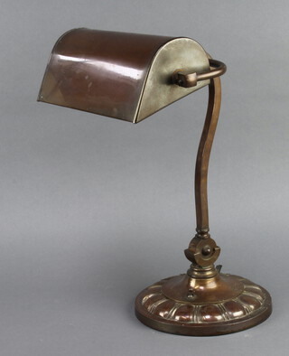 A 1930's copper bank lamp raised on circular base 39cm x 20cm 