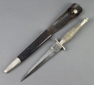 An early first pattern Fairburn Sykes dagger together with scabbard. The blade measuring 168mm (in total 295mm) weighing 242g and stamped The FS Fighting Knife and Wilkinson Sword Co Ltd.  The dagger has no other official markings or stamps. The early brown leather scabbard (without wings) has a nickel chape.

The dagger was the property of Royal Marine L G Elliot service no PO/X5111 (name and number on reverse of scabbard) whose service medals are also being sold in this auction as lot 450 