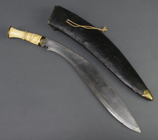 A presentation Kukri with 37cm blade, the bone handle marked From Lalupa Sailo Aijal Lushai Hills Assam to Captain N R Mathews, complete with 2 skinning knives and leather scabbard 
