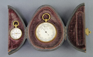 A pocket barometer with silvered dial and gilt case 3.5cm together with a compass contained in a leather carrying case (thermometer missing) 