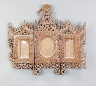 A 19th Century Burmese carved and pierced hardwood triptych photograph frame surmounted by a figure of an eagle 54cm h x 60cm 