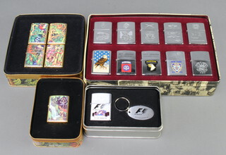 Ten Zippo lighters of American military interest contained in a rectangular metal tin, two 1995 limited edition Mysteries of The Forest Zippos and a Zippo F1 Formula One lighter and keyring contained in a rectangular tin 