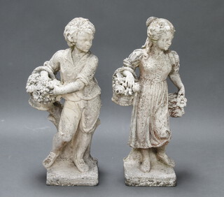 A pair of well weathered reconstituted stone classical figures of a boy and girl with baskets of fruit, raised on square bases 73cm h x 22cm and 74cm h x 23cm  