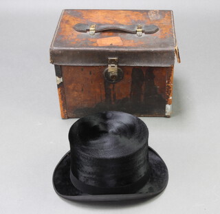 Lincoln Bennett, a gentleman's black silk top hat, size 7 1/4, contained in a brown leather carrying case 25cm h x 35cm w x 25cm d by The Army & Navy Co-operative Society 