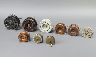 A brass centre pin fishing reel 2", a The Bijout centre pin fishing reel 3", a W.Chalkley of Winchester brass and aluminium centre pin reel 2 1/2", 1 other aluminium reel 3 1/2", a Harris black Bakelite centre pin fishing reel 4 1/2", a brown centre pin fishing reel 4" and 3 wooden and brass reels 3" and 2 1/2"  