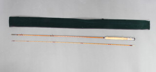 Fosters of Ashbourne "The Champion", a 2 piece 8' split cane fly fishing rod contained in a green bag 