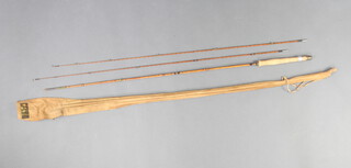 An Ogden Smith 7'6" split cane brook trout fishing rod with ferrule stopper and butt spike in original bag 