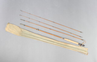 A Walker Bampton 9' split cane trout fly fishing rod with 2 tips contained in a brown cloth bag 