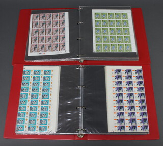 An album of part sheets of mint GB pre-decimal stamps together with an album of part sheets of GB decimal stamps (face value 324.00)  
