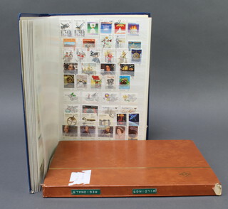A stock book of Australian mint and used stamps, Victoria to Elizabeth II and a stock book of New Zealand stamps George V to QEII