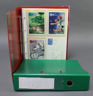 Two ring bind albums of Elizabeth II first day covers and PHQ cards