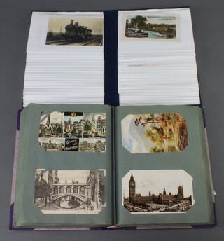 Two albums of black and white and coloured postcards