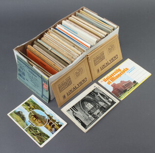 A quantity of black and white and coloured postcards 
